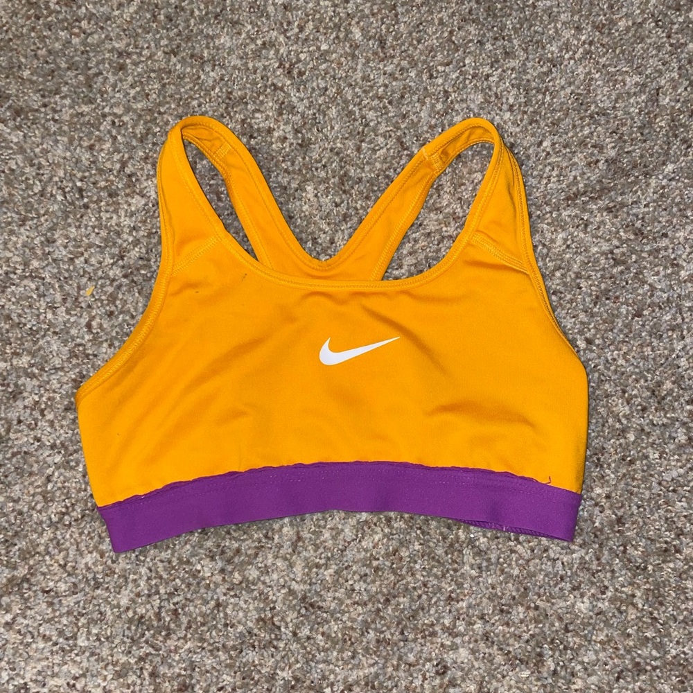 Size small Nike sports bra. Lightly worn. Orange and purple.